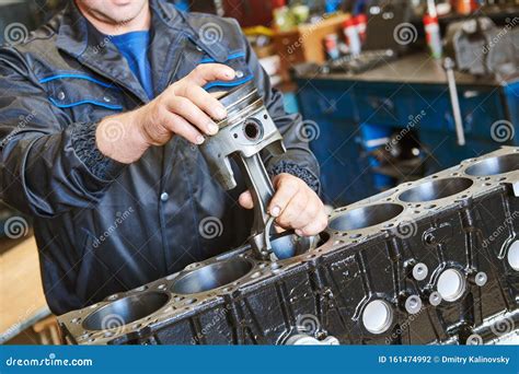 Diesel Truck Engine Repair Service. Automobile Mechanic Installing ...