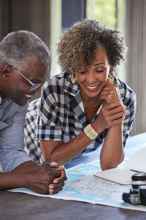 Retired Senior African American Couple Planning A Trip Together By Stocksy Contributor