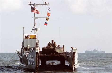 A Marine M1a1 Main Battle Tank Moves Toward The Open Ramp Of Utility Landing Craft Lcu 1658 The