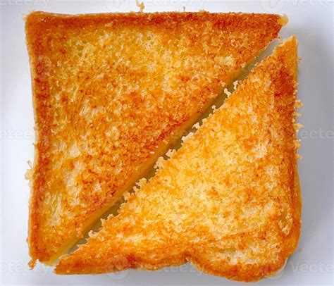 Two Piece Triangle Slices Of Toasted Bread Made From White Wheat Flour