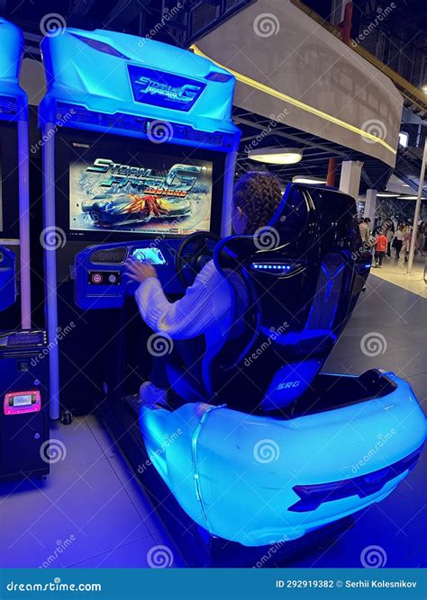 Woman Driving a Racing Game. Girl on a Racing Car Simulator. Concept ...