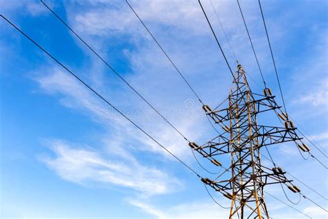 Electrical High Voltage Tower On Blue Sky Background Stock Photo