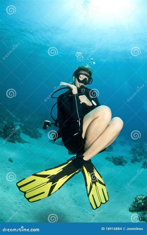 Blonde Scuba Diver Swims In Clear Blue Water Stock Photo Image Of