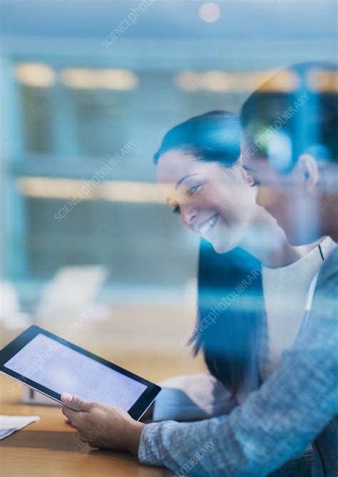 Businesswomen Using Digital Tablet In Office Stock Image F0167364