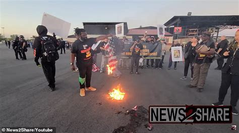 Shocking moment communist revolutionaries burn American flags outside ...