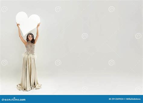 Perfect Happy Fashion Model Woman In Luxurious Dress Holding Empty