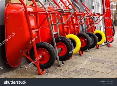 red wheel barrow construction images stock  vectors