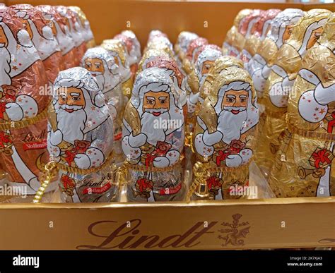 Group Of Lindt Chocolate Santa Claus Figures In A Supermarket Stock