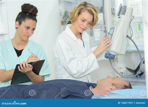 Radiologic Technician With Doctor During Magnetic Resonance Exam