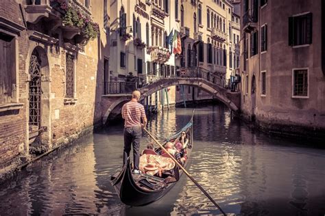 Premium Photo Gondola Floats Along Old Narrow Street In Venice Italy