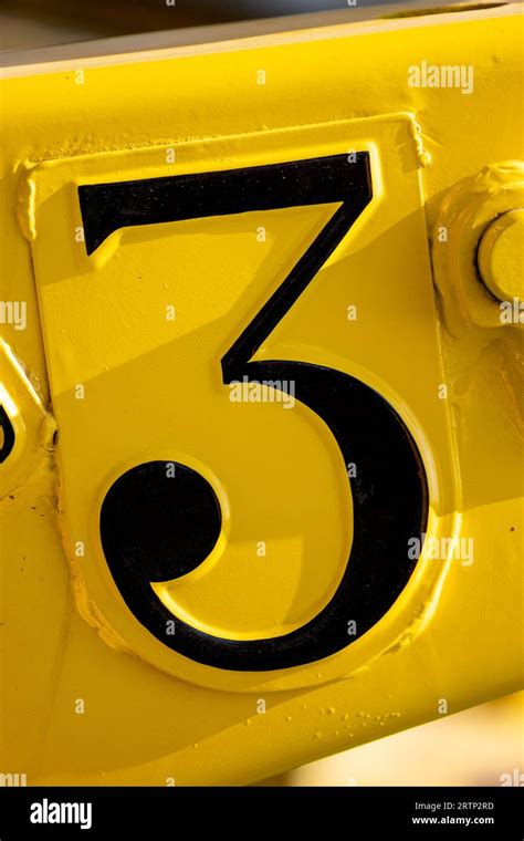 number    black  font text  metal yellow background