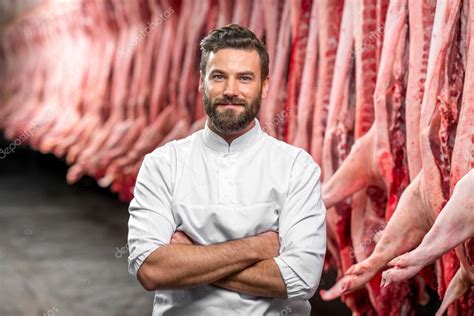 Portrait Of A Handsome Butcher At The Manufacturing Stock Photo By