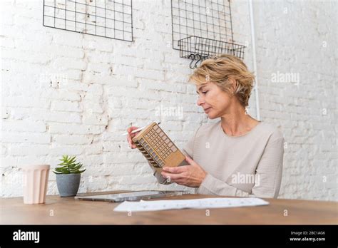 Mature Woman Working At Desk In Architectural Office Stock Photo Alamy