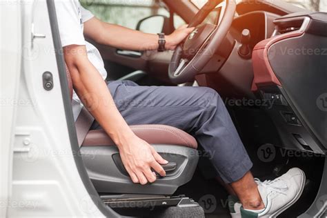 Hand adjust car seat before drive on the road . Ergonomic and safety
