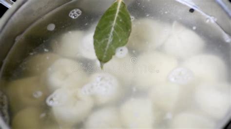 Throwing Dumplings Into A Pot Of Hot Water In Slow Motion Stock Video