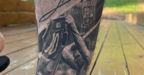 Lionel Messi tattoo located on the shin, black and grey