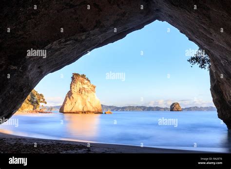 Cathedral Cove at sunrise Stock Photo - Alamy