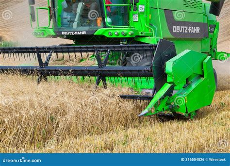 A Deutz Fahr Combine Harvester At Work Harvesting A Field Of Wheat