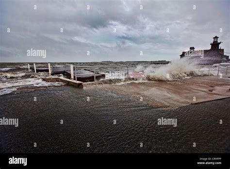 Waves Crash Over The Seawall In Downtown Cedar Key As Tropical Storm