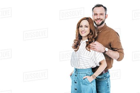 Beautiful Happy Couple Standing Together And Smiling At Camera Isolated