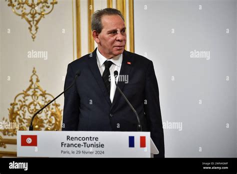 Tunisian Prime Minister Ahmed Hachani Looks On During A Press