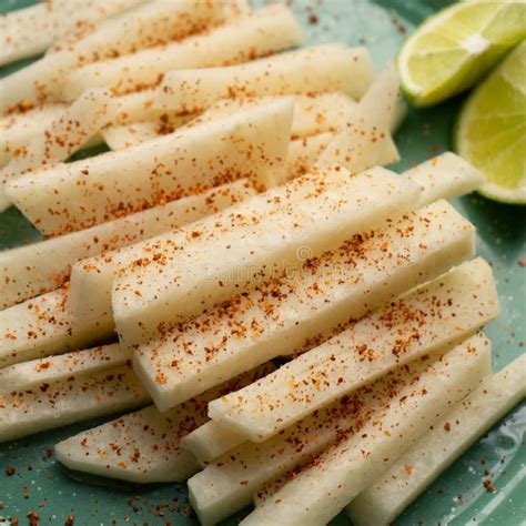 Mexican Yam Bean Also Called Jicama With Chili Powder Stock Image