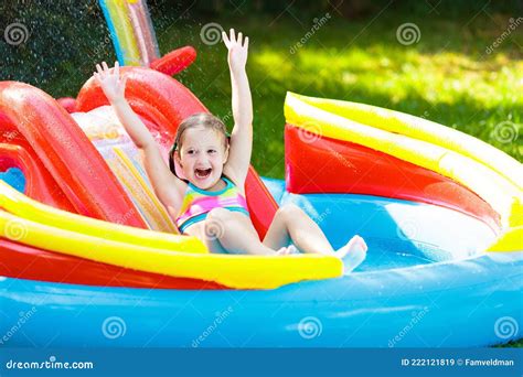 Child in Garden Swimming Pool with Slide Stock Image - Image of blue ...