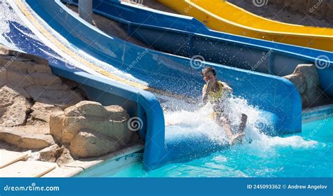 Little Girl On A Slide In A Water Park Stock Photo Image Of Child