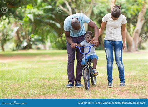 African family outdoors stock image. Image of bicycle - 50159153