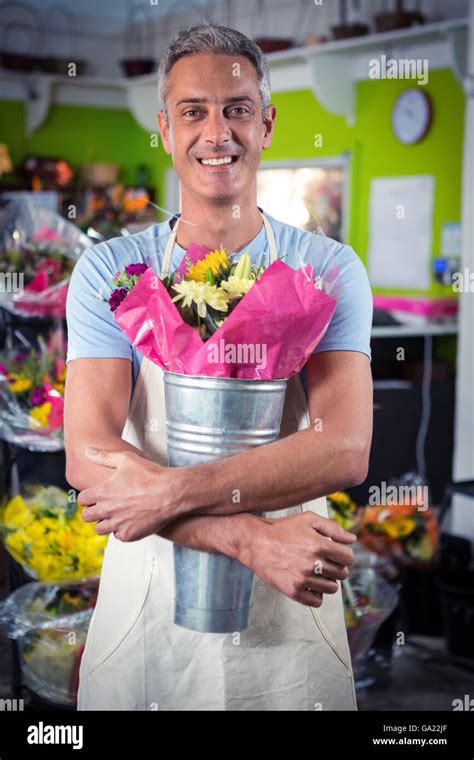 Male Florist Holding Flower Bouquet At Flower Shop Stock Photo Alamy