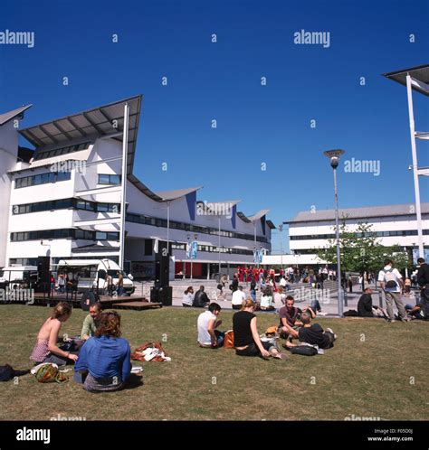 London England University Of East London Students Sitting On The Grass On Campus Stock Photo - Alamy