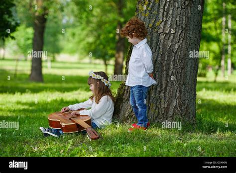 cute children playing guitar Stock Photo - Alamy