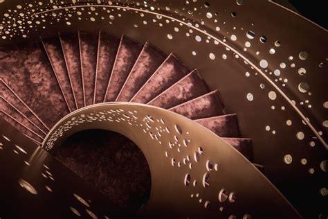 A Spiral Staircase With Lots Of Dots On It