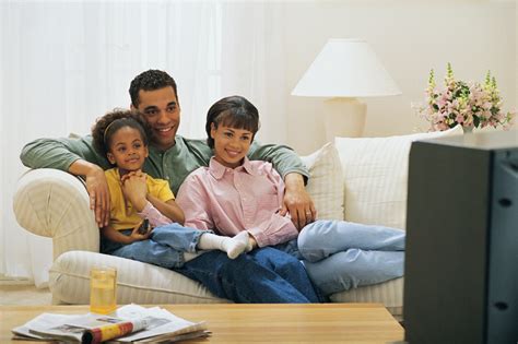 Family watching TV together Free Photo Download | FreeImages