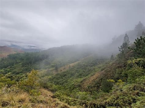 Premium Photo | Hike through the mountains between hills and waterfalls ...