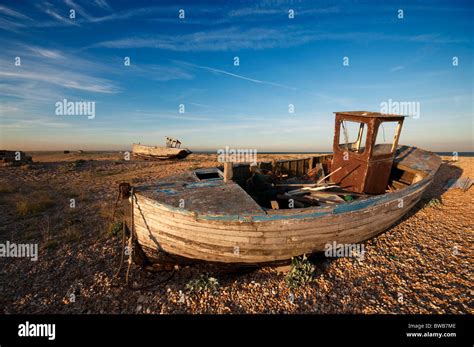 Old Derelict Fishing Boat On The Beach At Dungeness Kent Uk Stock