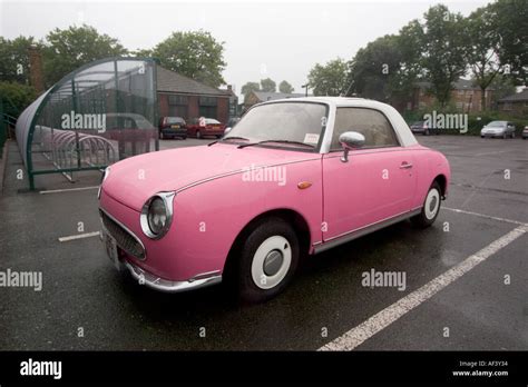 Pink and white two tone Nissan Figaro classic cult car Stock Photo - Alamy