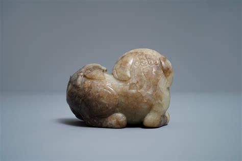 A Chinese Pale Grey Brown Jade Model Of A Buddhist Lion Th C