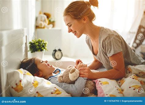 Mother Wakes Her Daughter In Bed In Morning Stock Image Image Of