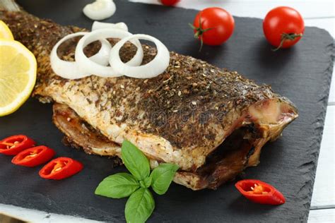 Fried Carp Fish On The Table Baked Fish With Vegetables Stock Photo