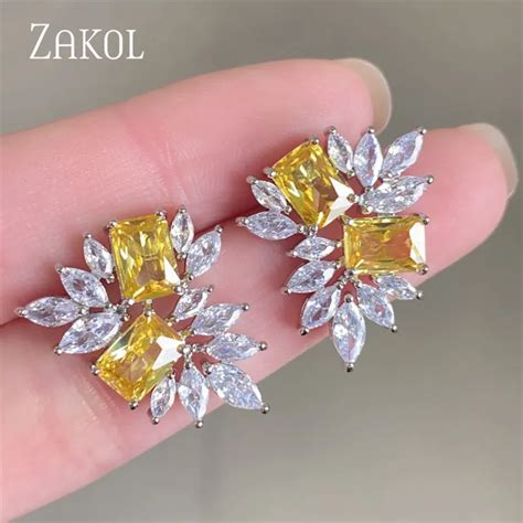 Zakol Fashion Yellow Leaf Stud Earrings For Women Shinny Geometry Cubic