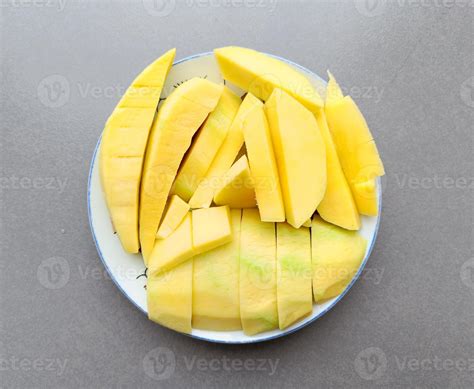 Green Mango Sliced On A White Plate Thai Fruit Summer Top View