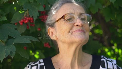 Beautiful Old Grandmother With Grey Hair And Face With Wrinkles Wearing