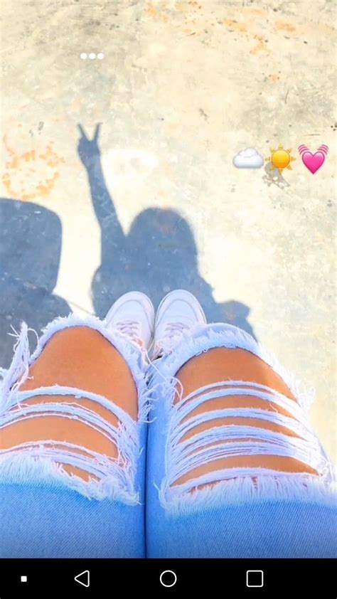 The Shadow Of A Person S Legs And Leg In Ripped Jeans