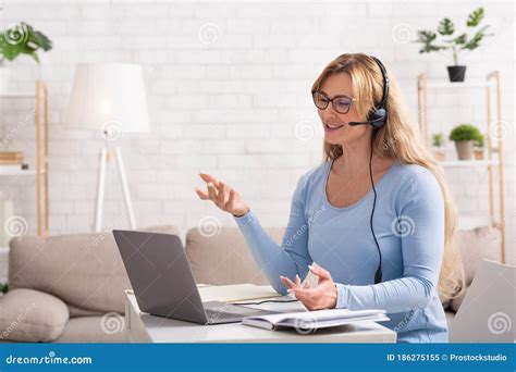 Customer Support Remotely Woman With Headset And Laptop In Workplace