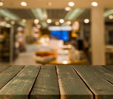 A Wooden Table Top In Front Of A Store