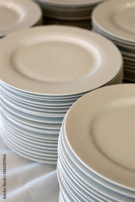 Stacked White Plates For A Buffet Stock Photo | Adobe Stock