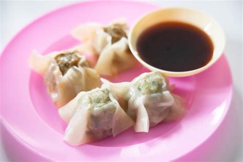 Premium Photo Chinese Dim Sum With Dipping Soy Sauce