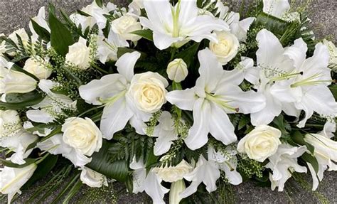 White Lily And Rose Casket Spray Funeral Flowers Waltham Abbey