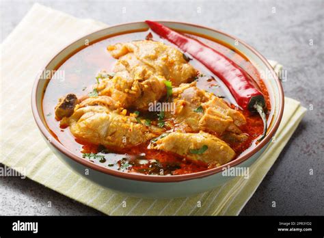 Malvani Masala Spicy Chicken Curry With Coconut Closeup On The Bowl On The Table Horizontal